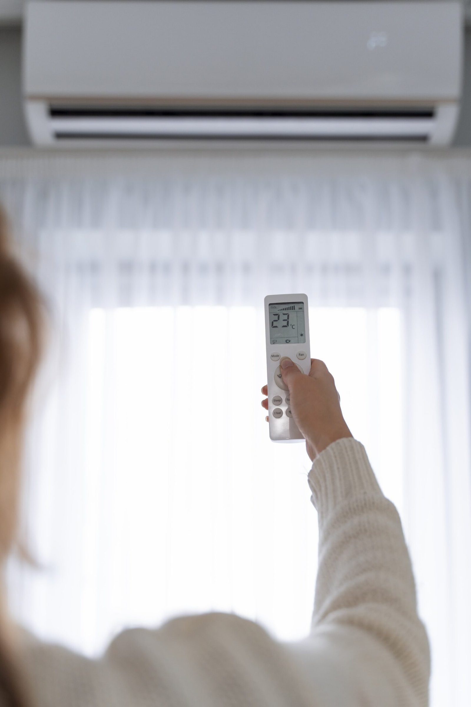 woman-holding-remote-start-heater-min