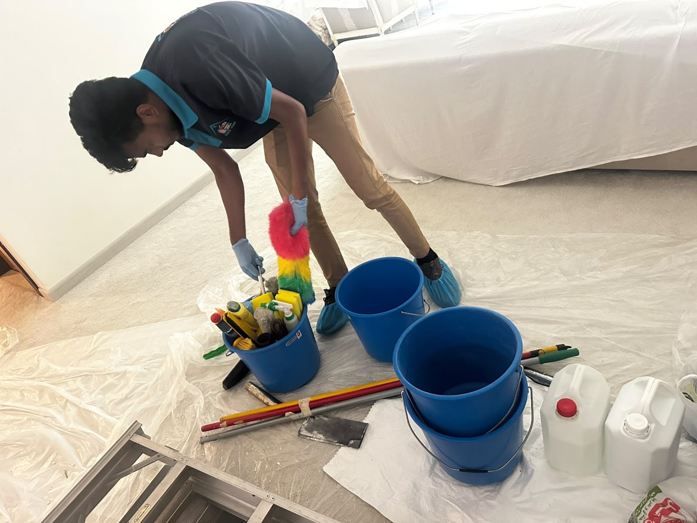 Rapid Home team member preparing cleaning equipment